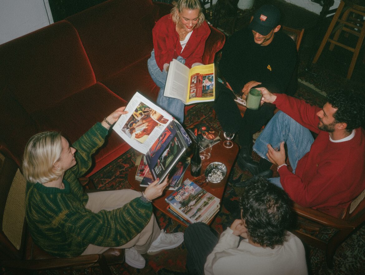 Friends gathered together outdoors at sunset