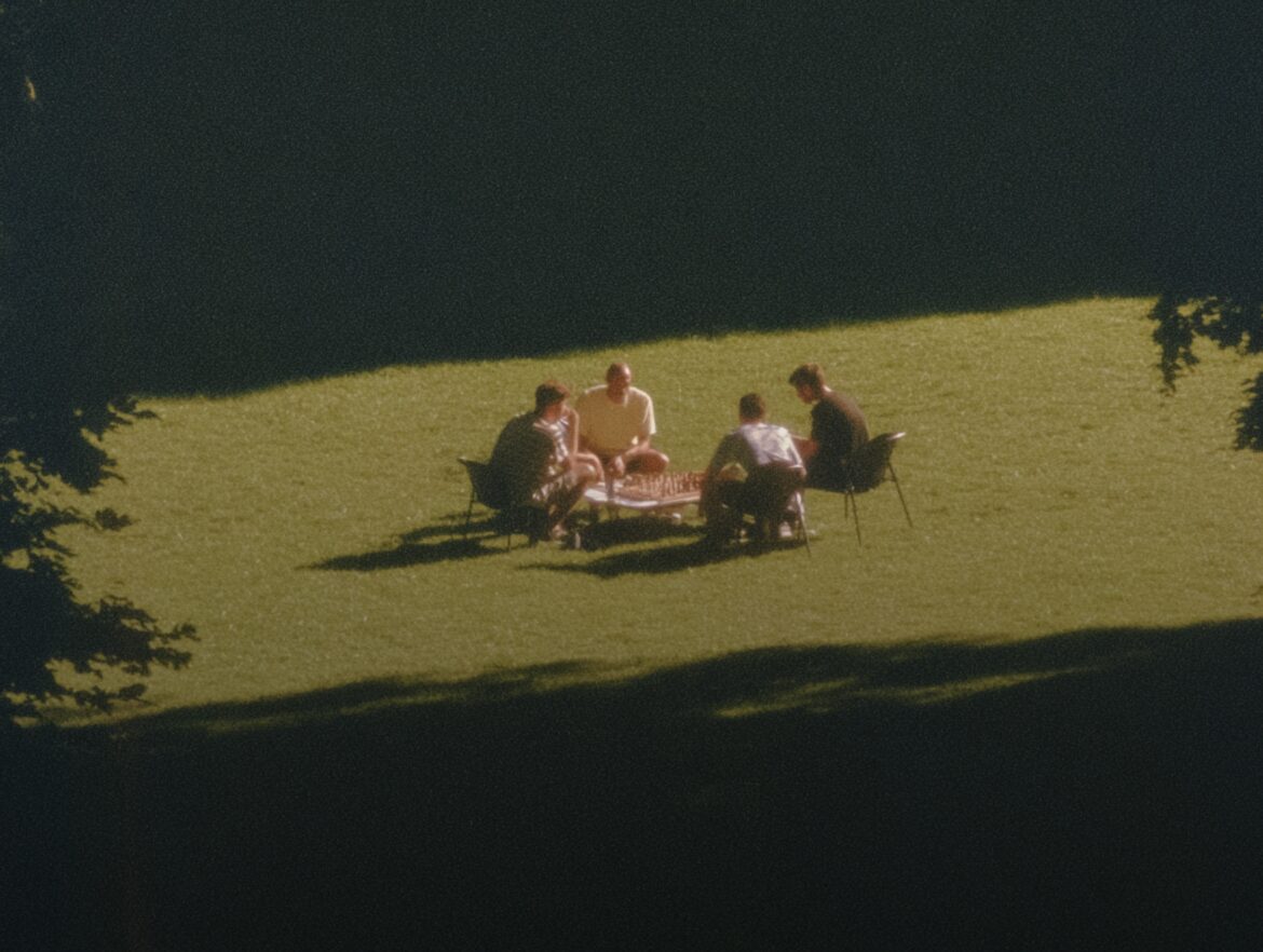 Friends gathered together outdoors at sunset