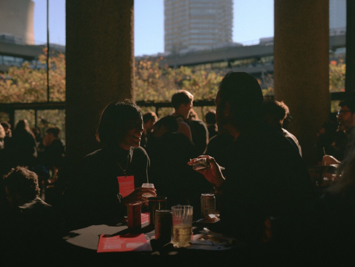 Friends gathered together outdoors at sunset
